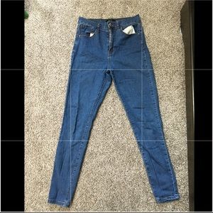 Blue skinny jeans with brown trimming high waisted
